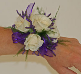 Purple and white spray rose wrist corsage from The Posie Shoppe in Prineville, OR
