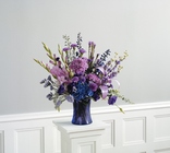 Vased arrangement in purples and blues