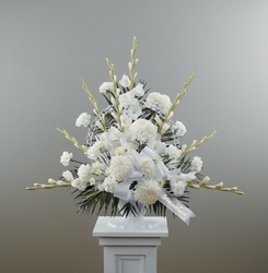 Traditional white basket sympathy arrangement from The Posie Shoppe in Prineville, OR