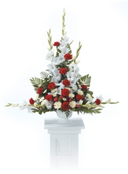 Traditional red and white sympathy arrangement from The Posie Shoppe in Prineville, OR