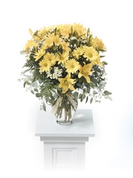 Yellow vased arrangement from The Posie Shoppe in Prineville, OR