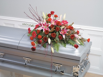 Stargazer and rose casket spray from The Posie Shoppe in Prineville, OR