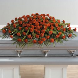 Red carnation full casket spray from The Posie Shoppe in Prineville, OR