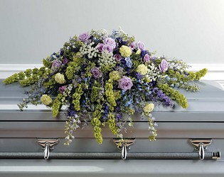 Lavender and blue casket spray from The Posie Shoppe in Prineville, OR