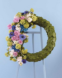 Leaf covered wreath with floral accent from The Posie Shoppe in Prineville, OR