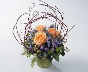Roses and branches arrangement from The Posie Shoppe in Prineville, OR