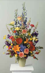 Vibrant fresh arrangement in urn from The Posie Shoppe in Prineville, OR